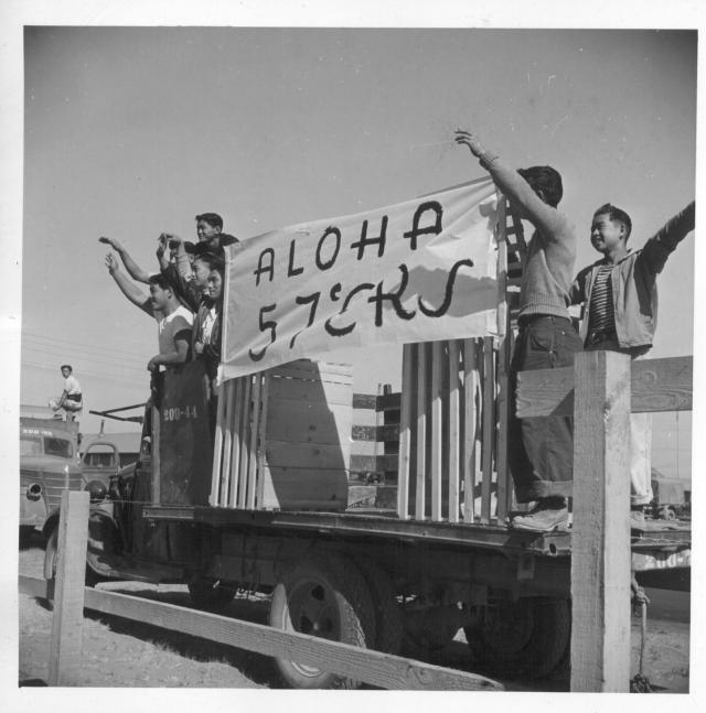 Residents of block 57, at the Tule Lake Center, wave farewell to friends entraining for other centers. -- Photographer: Mace, Charles E. -- Newell, California. 9/?/43. Source.