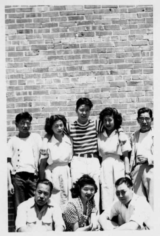 Hospital staff[?] in front of wall at Tule Lake Relocation Center. 1941/1945. Source.