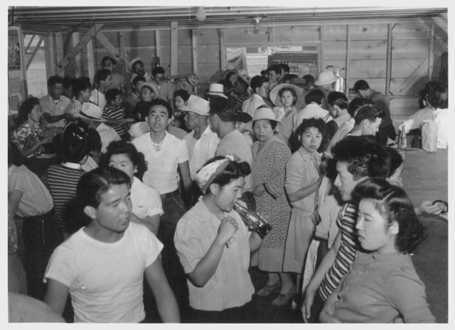 Tule Lake--Newell, Calif.--A view showing part of the crowd at general store no. 1 at this War Relocation Authority center where evacuees of Japanese descent are spending the duration. -- Photographer: Stewart, Francis -- Newell, California. 7/1/42. Source.