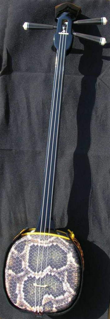 Sanshin - an Okinawan musical instrument (synthetic snakeskin here). Photo by TimDuncan, 2 Apr 2007.