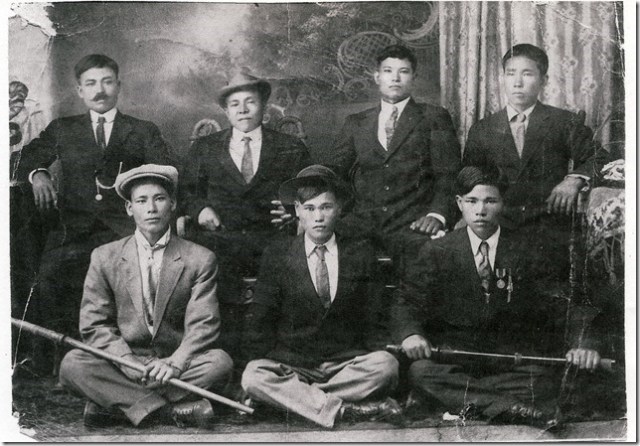 Hoichi and and his dad Hoyei Inafuku among a group of Okinawan men.  Hoichi is the young man in the middle sitting on the floor.  His father Hoyei, my grandfather, is sitting on the chair with his left arm on the table... the one without the mustache.
