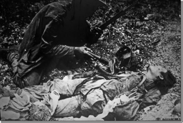 This young nurse was killed by the Marine kneeling over her, holding a grenade that he found in her possession.
